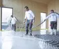 Baumit Alpha 2500 self-leveling floor underlayment system with prefabricated slab with tabs for installation of heating pipes