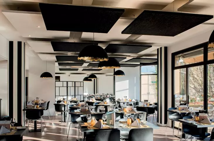 AMF THERMATEX® Sonic Sky ceiling islands (any shape) help to achieve friendly acoustics in interiors with inherently high noise levels