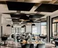 AMF THERMATEX® Sonic Sky ceiling islands (any shape) help to achieve friendly acoustics in interiors with inherently high noise levels