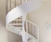 White painted ash staircase with steel balusters with discreet lighting