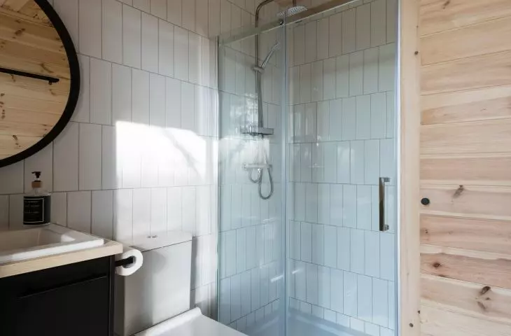 Forest Gazebo, bathroom lined with white tiles