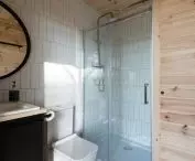Forest Gazebo, bathroom lined with white tiles