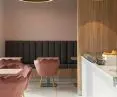 Interior of Żak ice cream shop, golden lamps