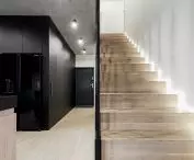 A wooden staircase leads to the first floor