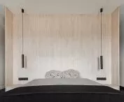 Wooden bed cover goes into the wall