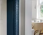 decorative band around the wooden front door