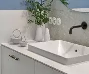 The bathroom is kept in light tones