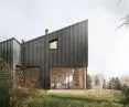 The dark façade is made of trapezoidal sheet metal