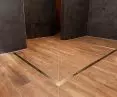 An interesting non-standard solution is to arrange the drains in the shape of a corner or the letter 