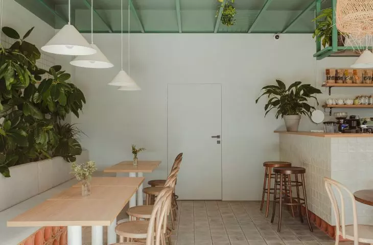 Green ceiling contrasts with white walls