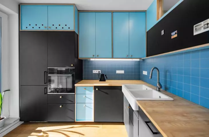 The kitchenette is a combination of off-the-shelf pieces and parts created to order by a carpenter
