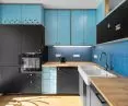The kitchenette is a combination of off-the-shelf pieces and parts created to order by a carpenter