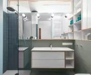 The bathroom in the living area is illuminated by narrow glazing