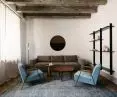 The architects preserved the original beamed ceiling in the apartment