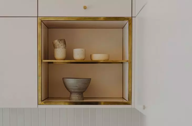 Simple, minimalist furniture is diversified with gold accessories