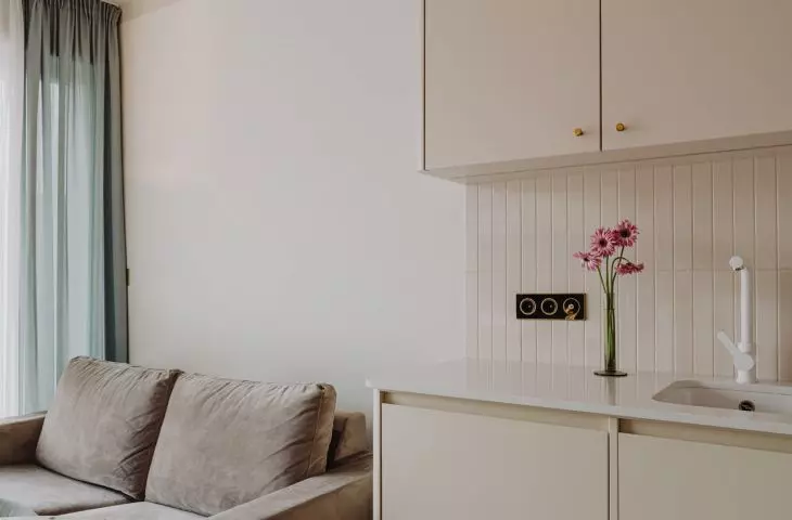 The open space houses the kitchen with dining area and living room