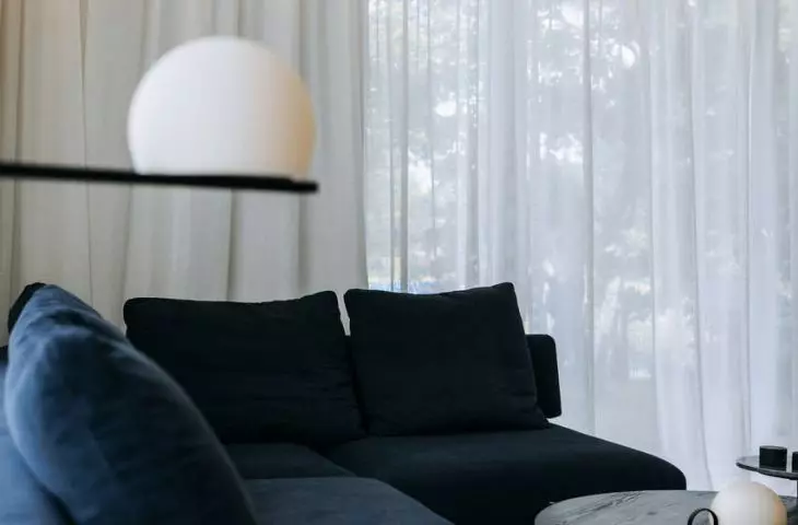 Navy blue sofa as a color accent in the living room