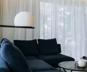 Navy blue sofa as a color accent in the living room