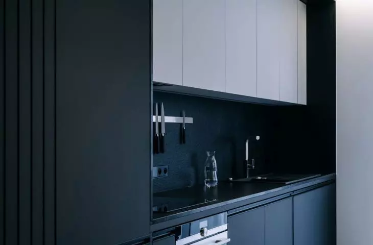 dark furniture contrasts with light floors and ceiling