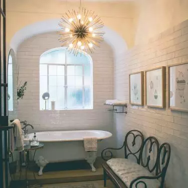 Bathroom with a striking chandelier