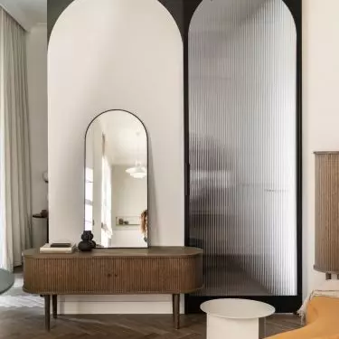 Mirror and space separating the bedrooms from the living room