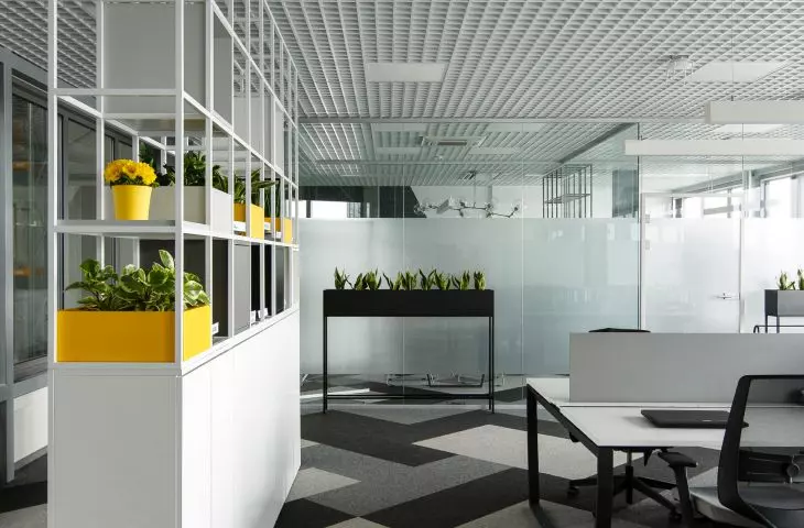 Openwork shelving is an important element that separates space in the office