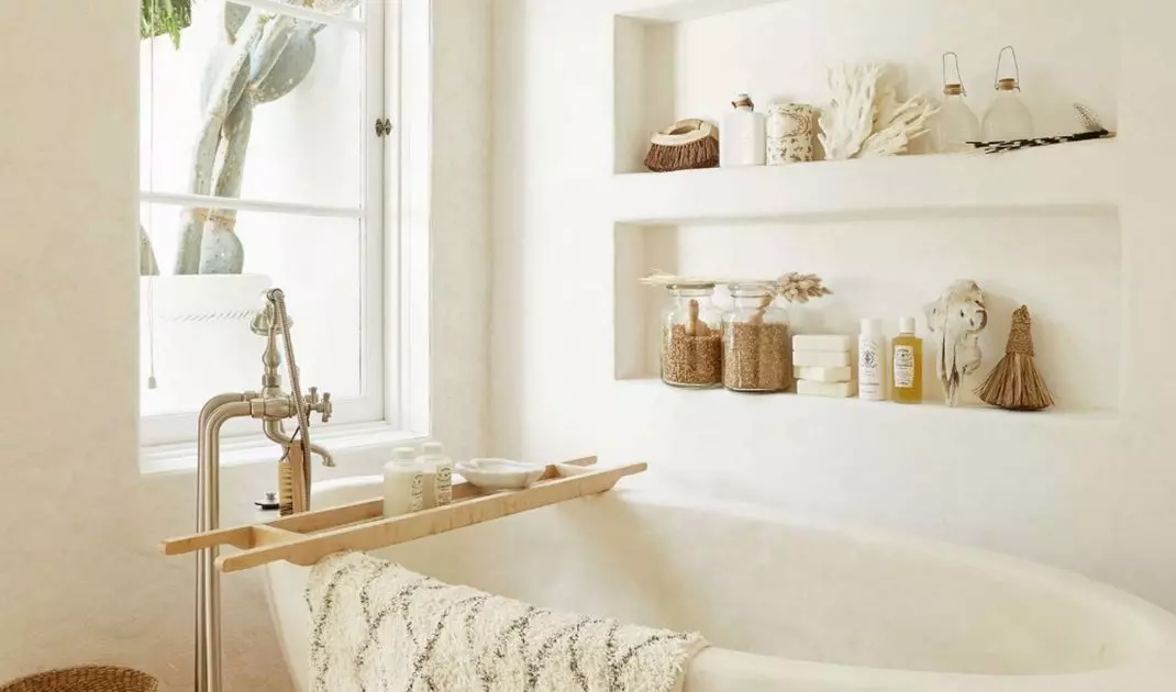 Ascetic bathroom bathed in white