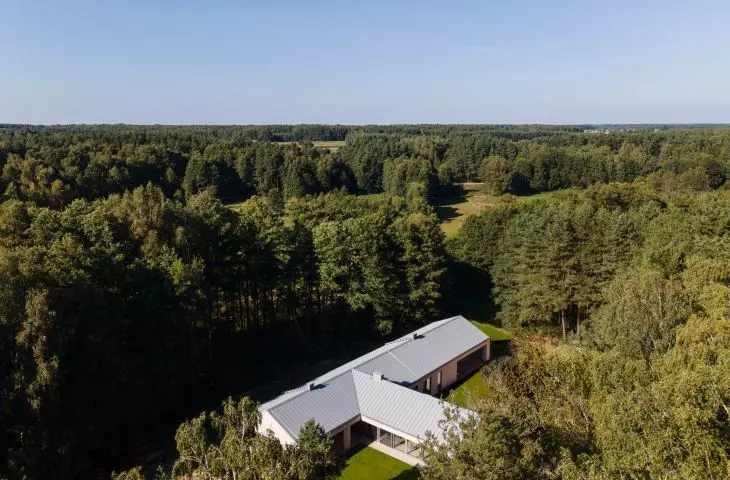 The clearing house is surrounded by mixed forest