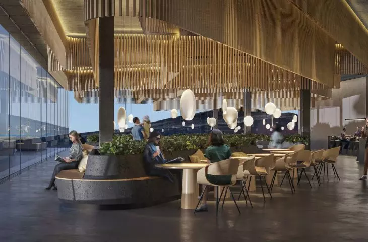 The dining area has been divided by wooden backlit elements on the ceiling, which delineate the tables