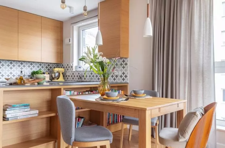 Dining room against the backdrop of the kitchen