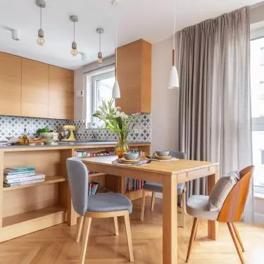 Dining room against the backdrop of the kitchen