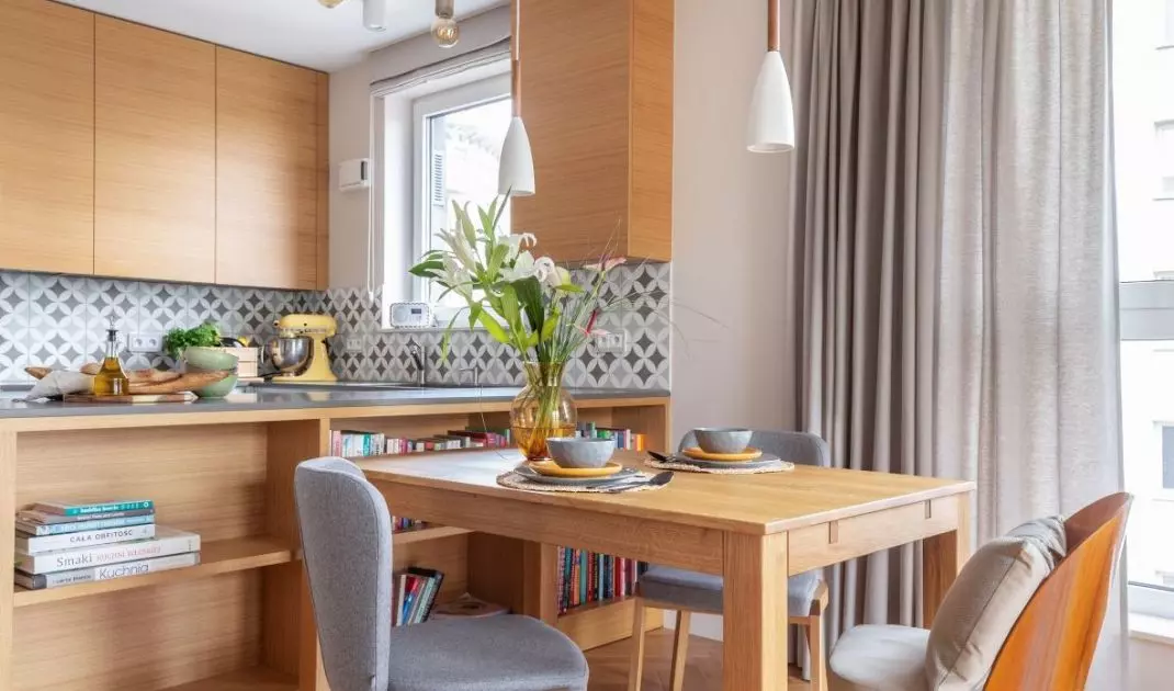Dining room against the backdrop of the kitchen