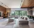  The living room overlooks a slope covered with spruce trees