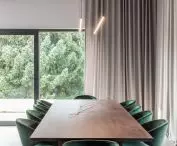 Long dining table and wood on the ceiling