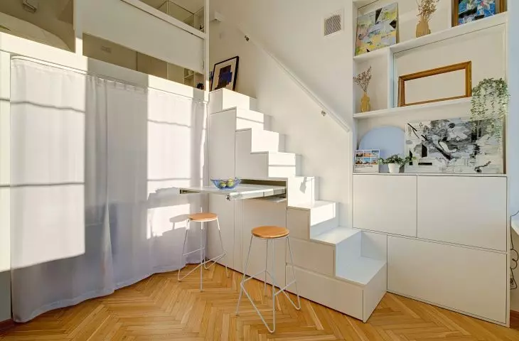 Stairs lead to the mezzanine