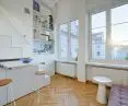 A distinctive feature is the renovated, century-old wooden floor