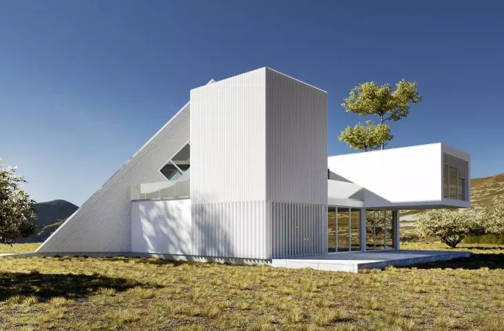 The white of the facade contrasts with the muted green of the surroundings