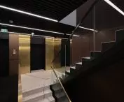 we wnętrzu dominują ciemne kolory przełamane złotymi akcentami