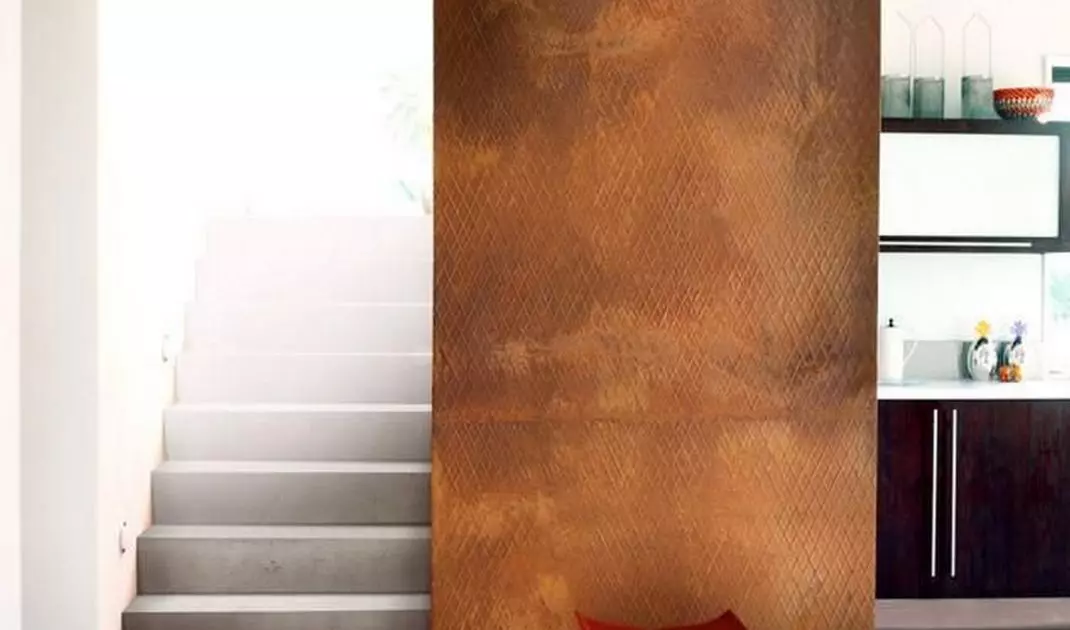 Wall covered with embossed Korten sheet metal