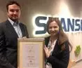 Skanska representatives receive the 