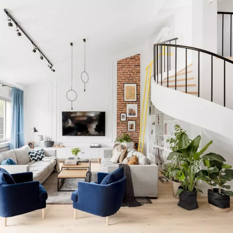 The dominant element in the living room is the fan staircase