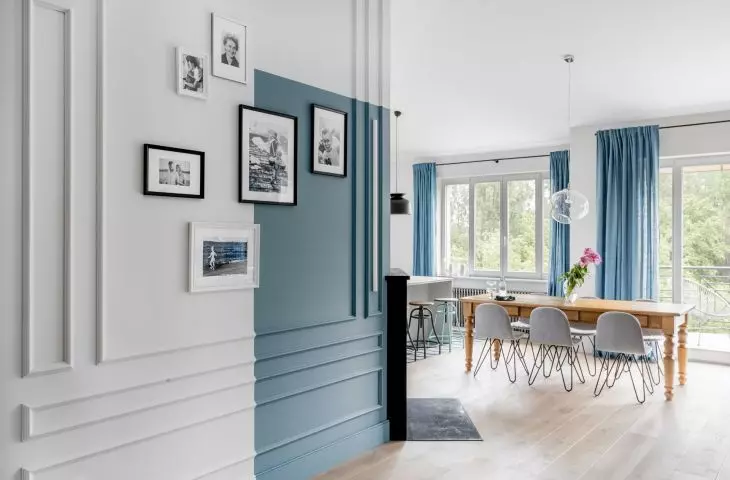 The blue accent continues in parts of the hallway and kitchen