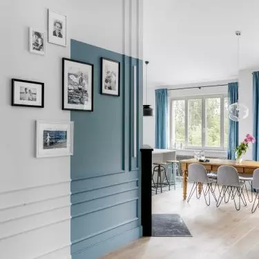 The blue accent continues in parts of the hallway and kitchen