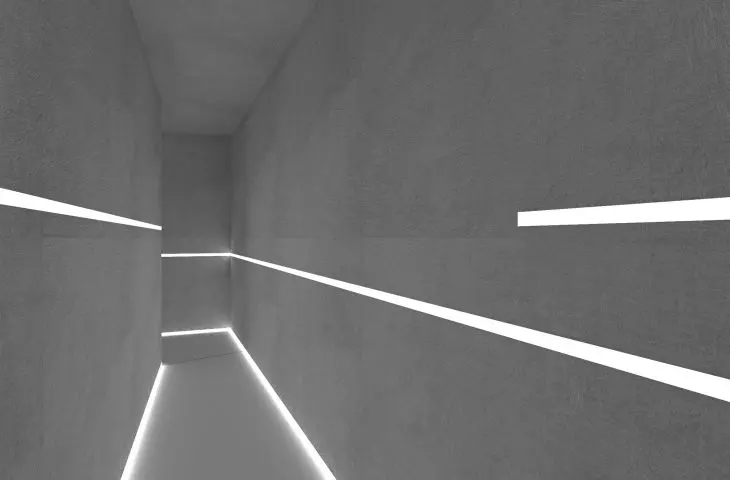 A lighted corridor leads to a second garden
