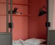 The walls of the bedroom were painted a strong brick shade