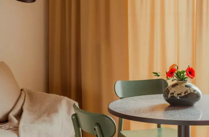 The table has a top made of terrazzo