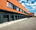Budynek biurowy i centrum logistyczne piekarni Putka, elewacja z płytki mineralnej SAHARA