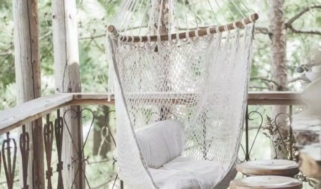 Suspended boho style armchair