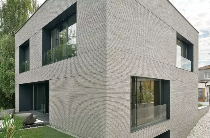 Slit house is covered with narrow and elongated ceramic tiles