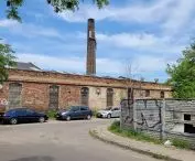 The buildings of the former factory from the south side, the boiler room chimney is visible